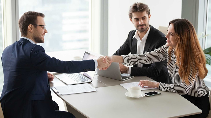 business handshake supplier buyer partnership negotiation contract signing meeting